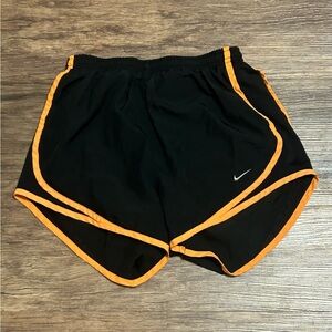 Nike XS athletic shorts with neon orange trim